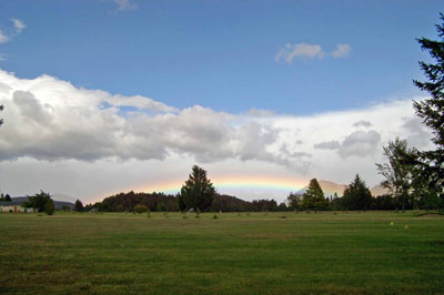 An image of a morning rainbow near Twizel, New Zealand.