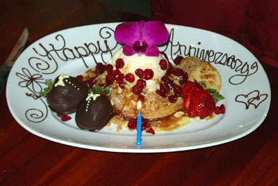 An image of “Happy Anniversary” spelled out in chocolate on a plate at a restaurant  in Tucson, AZ.