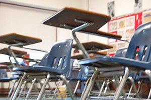 This image shows classroom desks awaiting students.