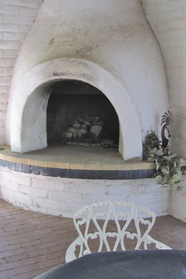 A photo of a cold fireplace.