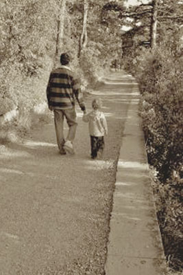 A photographic image of a father and child in autumn.