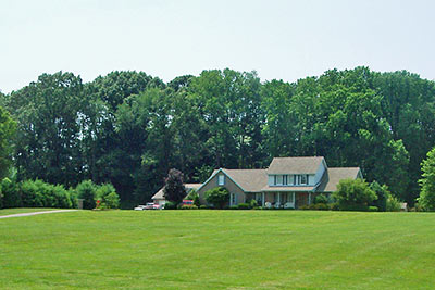 A photographic image of a house on a knoll in southern Indiana.