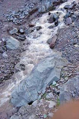 A photographic image of a rushing stream.