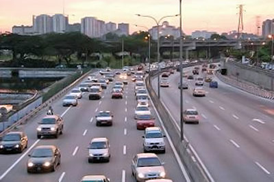 A photographic image of a busy freeway in Kuala Lumpur, Malaysia.