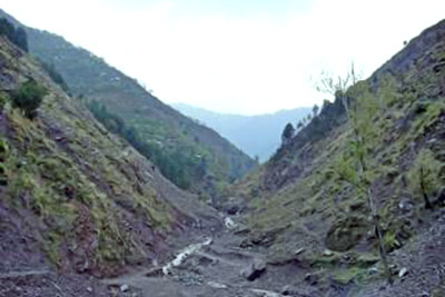 A photographic image of a dark valley.
