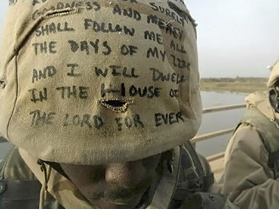 A photographic image of a Soldier with Psalm 23:6 on his helmet.