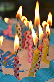 A photographic image of candles on a birthday cake.
