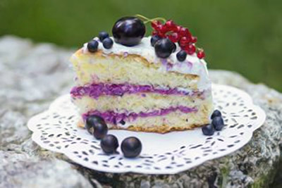A photographic image of a fresh berry cake.
