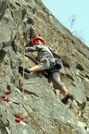 A photographic image of a rock wall climber.