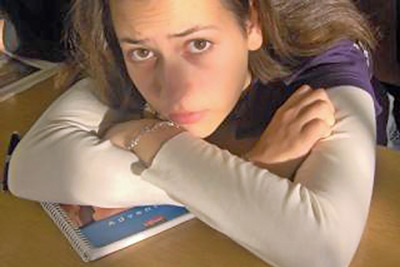 A photographic image of a sad teenage girl.