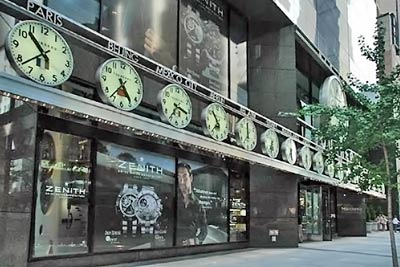 A photographic image of a building with several clocks that show time around the world.